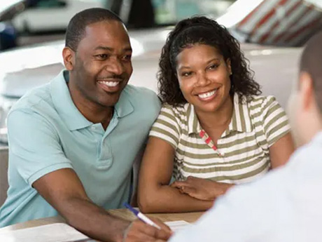 Couple buying a car